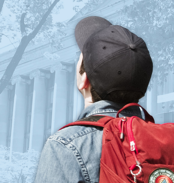 A student wearing a cap and backpack